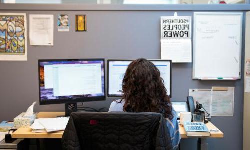 A UCS staff person at desk